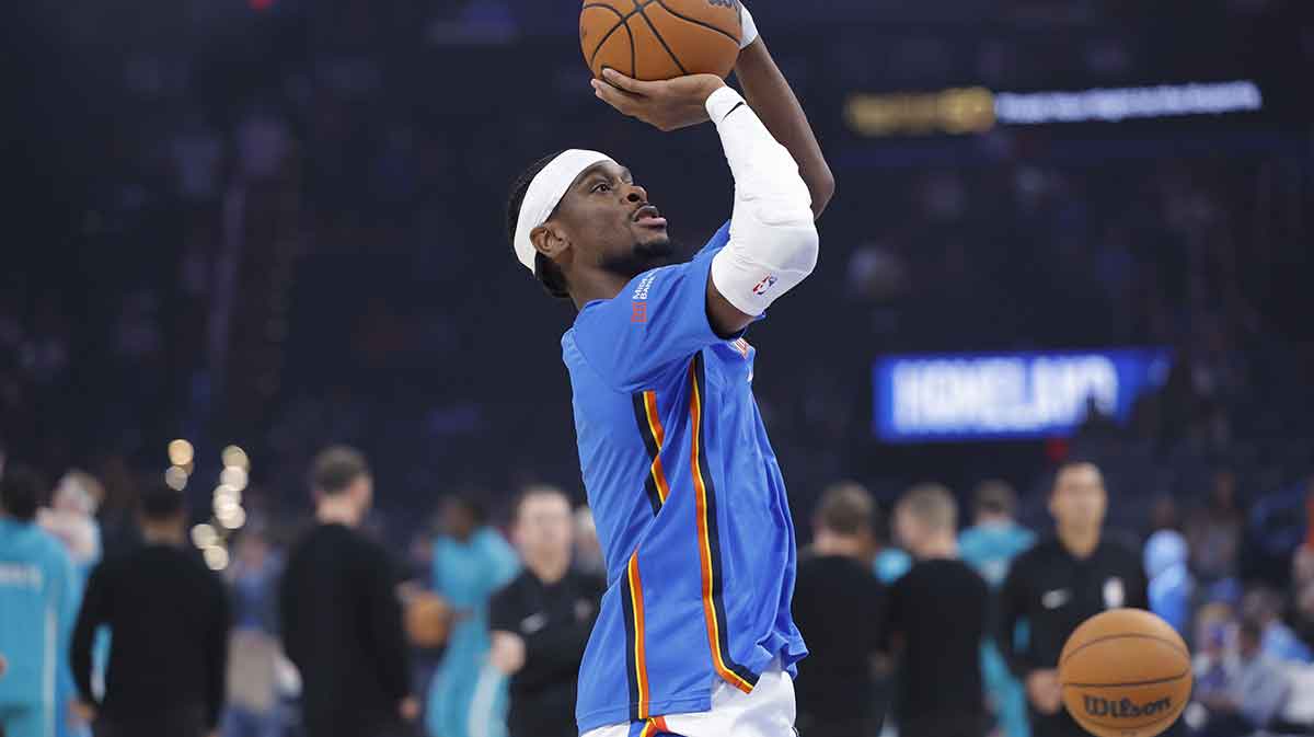 Thunder guard Shai Gilgeous-Alexander warms up before the start of a game between the Charlotte Hornets and the Oklahoma City Thunder at Paycom Center