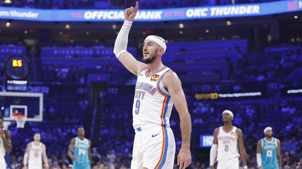 Thunder guard Alex Caruso (9) gestures after his team scores against the Charlotte Hornets during the second quarter of a game between the Charlotte Hornets and the Oklahoma City Thunder at Paycom Center