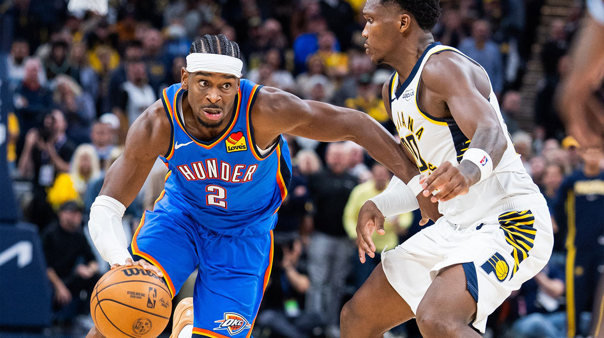 Thunder guard Shai Gilgeous-Alexander (2) free throws dribbles the ball while Indiana Pacers guard Bennedict Mathurin (00) defends in the second half at Gainbridge Fieldhouse