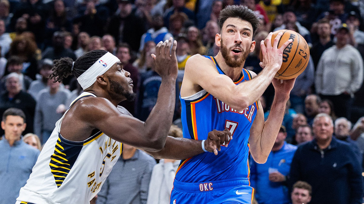 Oklahoma City Thunder center Chet Holmgren (7) shoots the ball while Indiana Pacers forward Jarace Walker (5) defends in the second half at Gainbridge Fieldhouse.