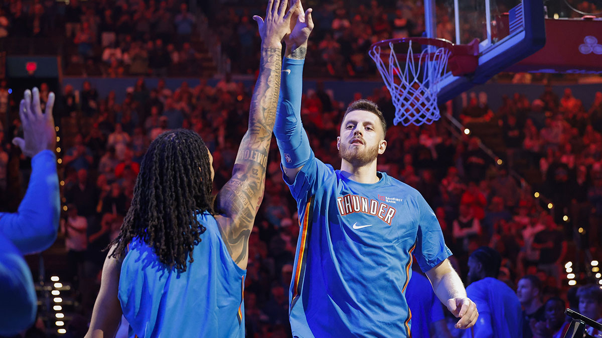 Thunder center Isaiah Hartenstein (55) during introductions before a game against the Washington Wizards at Paycom Center with Thunder's Nikola Topic in the background