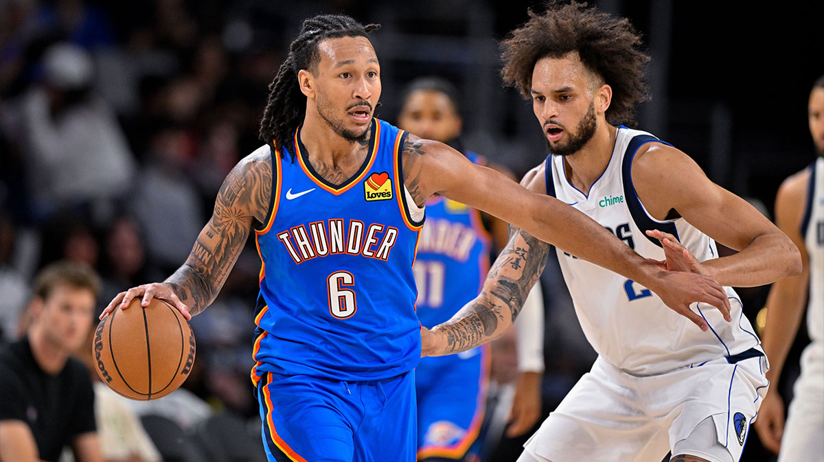Thunder forward Jaylin Williams (6) moves the ball past Dallas Mavericks center Dereck Lively II (2) during the game between the Dallas Mavericks and the Oklahoma City Thunder at Dickie's Arena