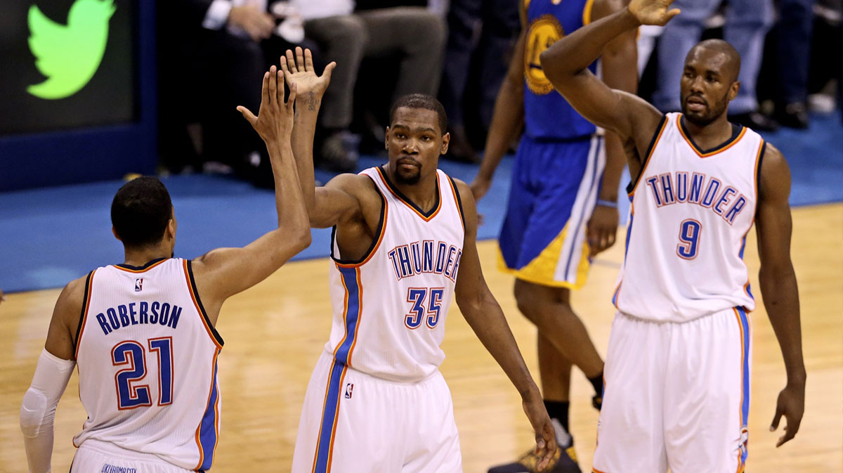Thunder forward Serge Ibaka (9) and forward Kevin Durant (35) and guard Andre Roberson (21) react during the second quarter against the Golden State Warriors in game four of the Western conference finals of the NBA Playoffs at Chesapeake Energy Arena with Thunder All-Star Shai Gilgeous-Alexander in the background