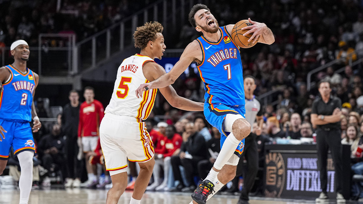 Thunder center Chet Holmgren (7) is fouled by Atlanta Hawks guard Dyson Daniels (5) during the second half at State Farm Arena
