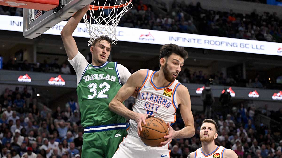 Thunder center Chet Holmgren (7) grabs a rebound in front of Dallas Mavericks forward Cooper Flagg (32) during the second half at the American Airlines Center