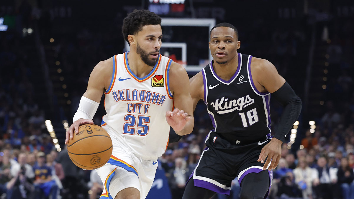 Thunder guard Ajay Mitchell (25) drives past Sacramento Kings guard Russell Westbrook (18) during the second half at Paycom Center with Thunder head coach Mark Daigneault in the background