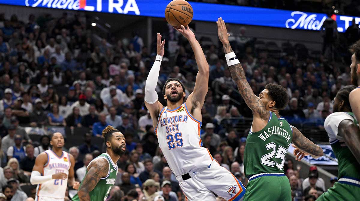 Thunder guard Ajay Mitchell (25) shoots the ball over Dallas Mavericks forward P.J. Washington (25) during the second quarter at the American Airlines Center with Thunder's Isaiah Hartenstein in the background