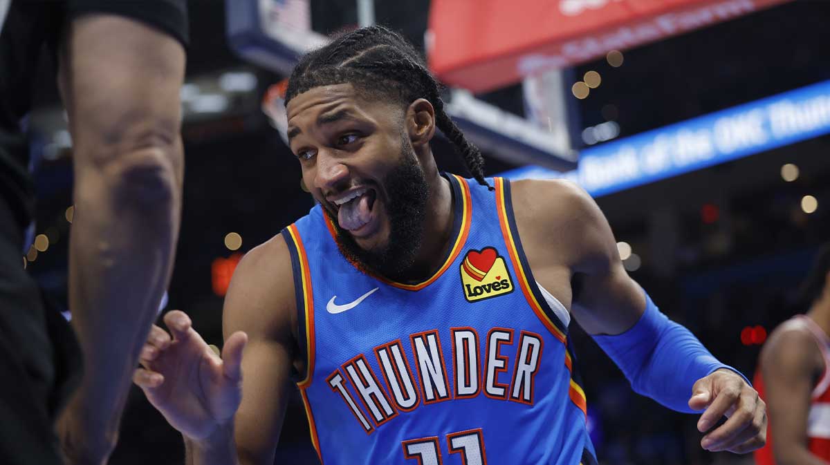 Thunder guard Isaiah Joe (11) reacts after a play against the Washington Wizards during the second half at Paycom Center with Thunder head coach Mark Daigneault in the background