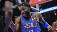 Thunder guard Isaiah Joe (11) reacts after a play against the Washington Wizards during the second half at Paycom Center with Thunder head coach Mark Daigneault in the background