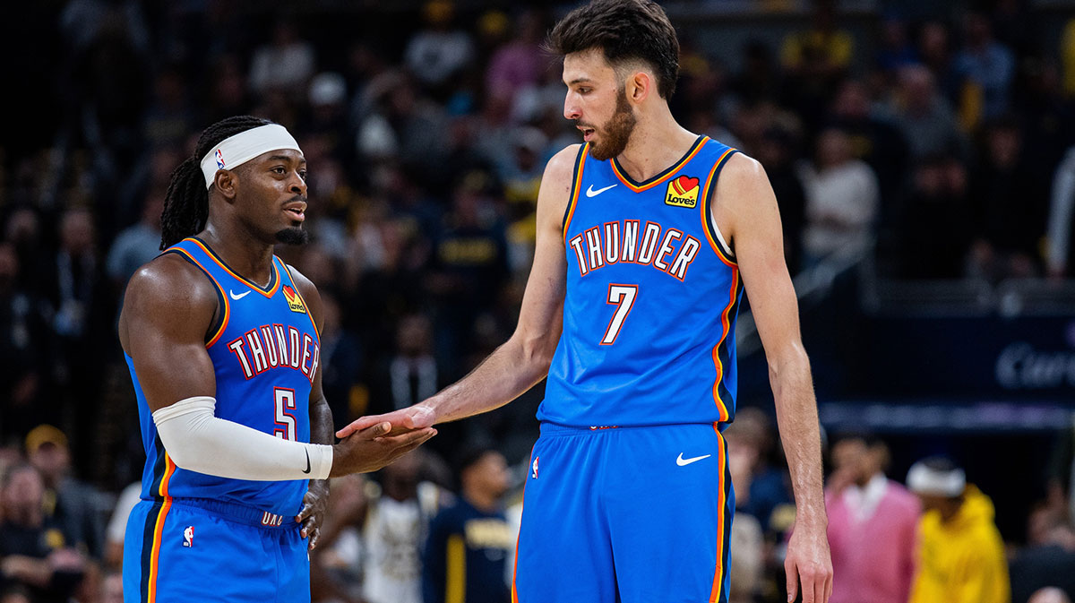 Oklahoma City Thunder guard Luguentz Dort (5) and center Chet Holmgren (7) in the second half against the Indiana Pacers at Gainbridge Fieldhouse.