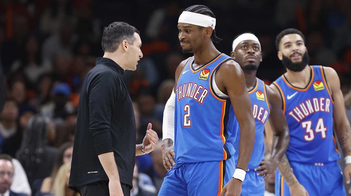 Thunder guard Shai Gilgeous-Alexander (2) and head coach Mark Daigneault talk during a time out against the New Orleans Pelicans during the second quarter at Paycom Center
