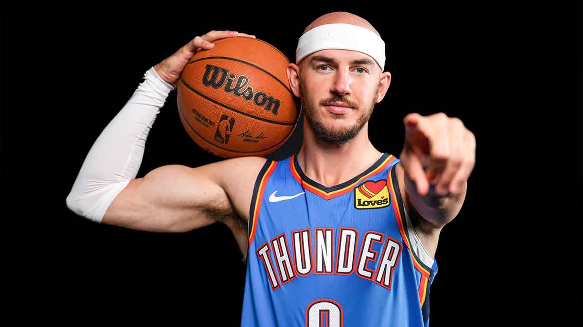 Alex Caruso (9) poses for a photo shoot during Thunder media day at Paycom Center in Oklahoma City on Monday, Sept. 29, 2025 with Thunder's Chris Youngblood in the background