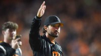 Tennessee Baseball coach Tony Vitello waves to the crowd during the NCAA football match between Tennessee and Kentucky in Knoxville.