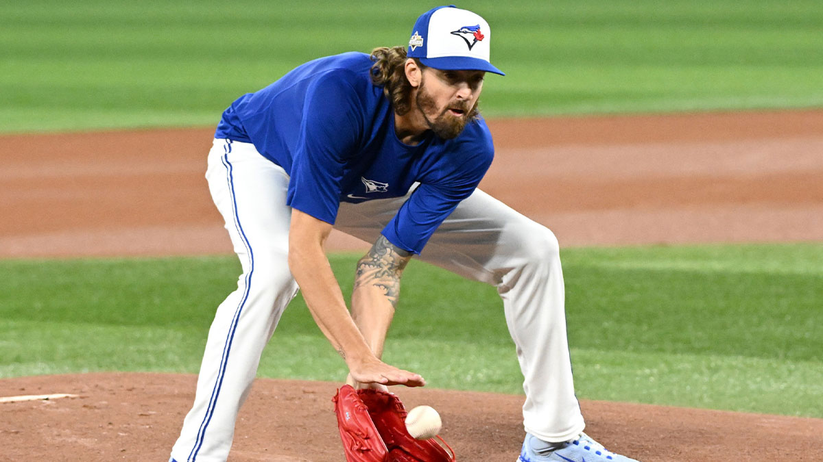 Toronto Blue Jays pitcher Kevin Gausman (34) fields the ball during workouts for the American League Championship Series at Rogers Centre.
