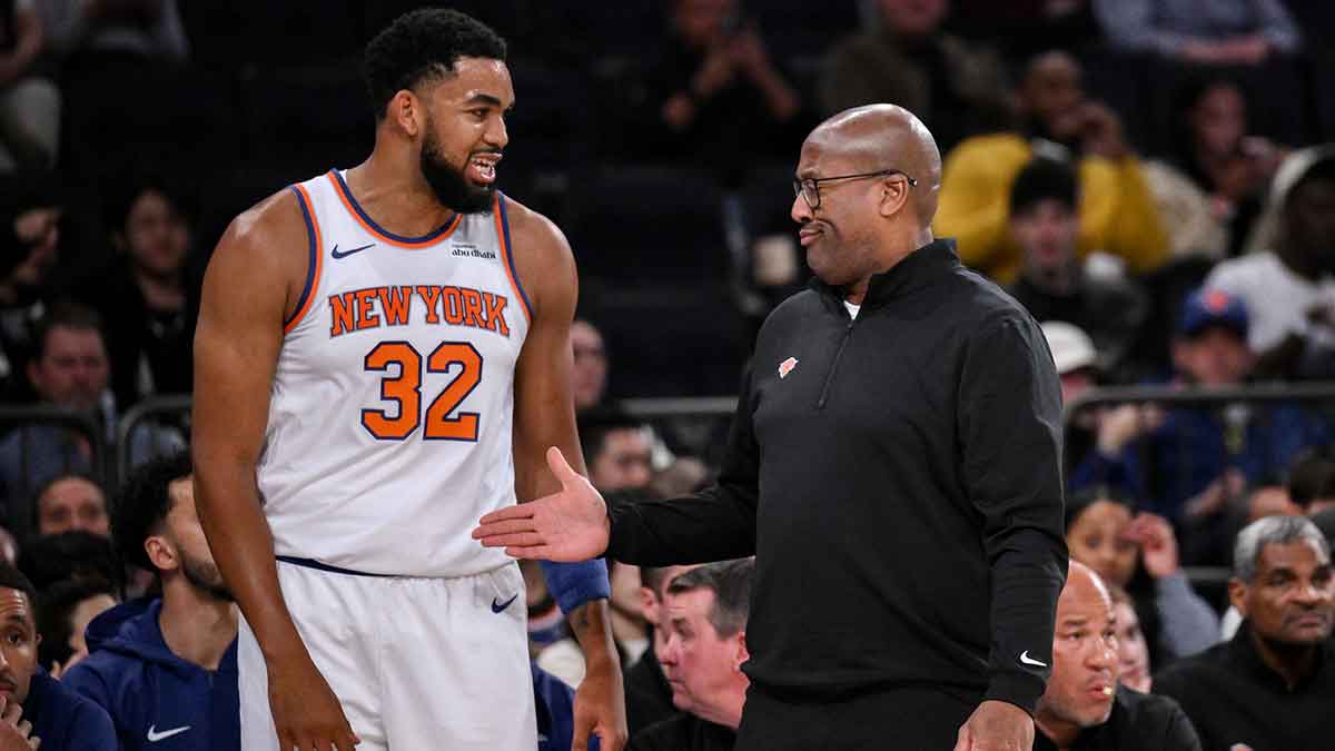 New York Knicks head coach Mike Brown reacts as he talks with center/forward Karl-Anthony Towns (32) during the first half against the Minnesota Timberwolves at Madison Square Garden.