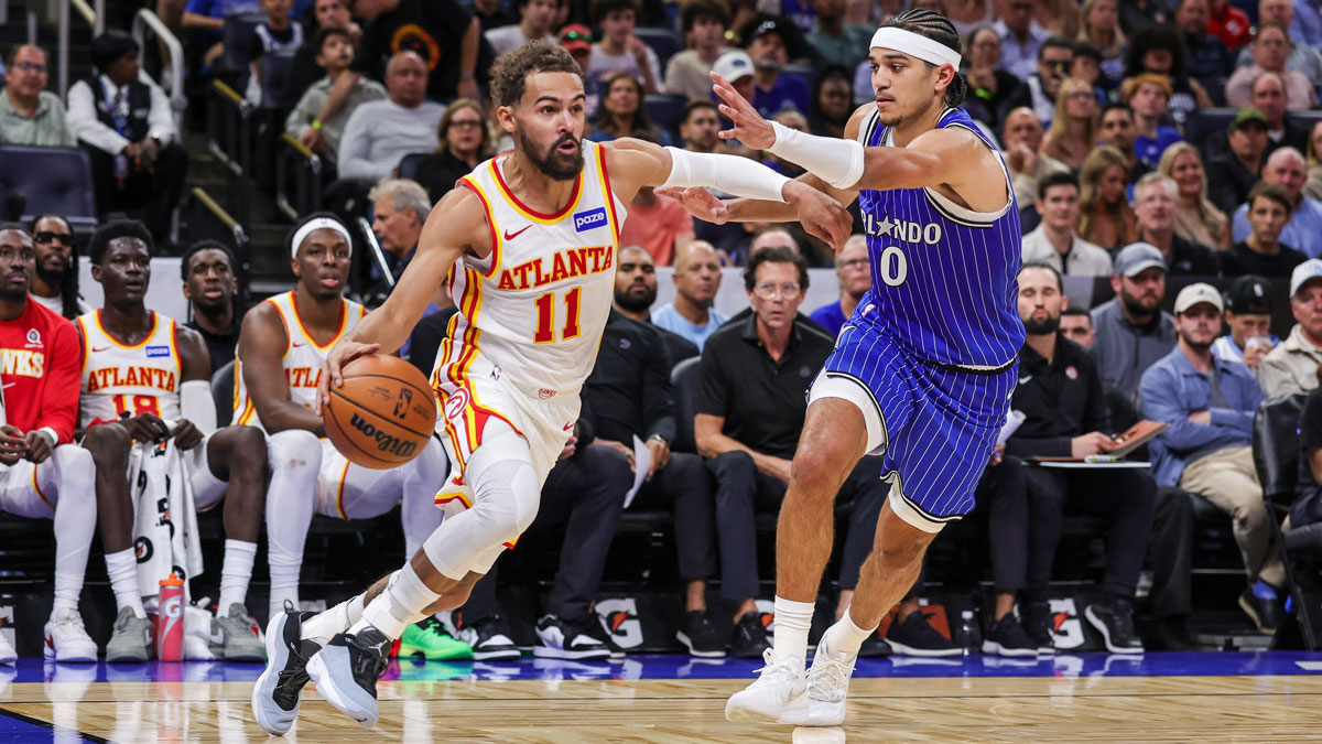 Atlanta Hawks guard Trae Young (11) drives around Orlando Magic guard Anthony Black (0) during the second quarter at Kia Center.