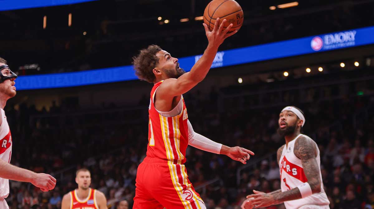 Atlanta Hawks guard Trae Young (11) shoots against the Toronto Raptors in the first quarter at State Farm Arena.