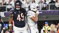 Minnesota Vikings wide receiver Justin Jefferson (18) reacts during the third quarter as Chicago Bears linebacker Tremaine Edmunds (49) looks on at U.S. Bank Stadium.