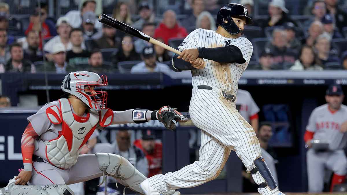New York Yankees center fielder Trent Grisham (12) follows through on a double against the Boston Red Sox during the seventh inning of game two of the Wildcard round of the 2025 MLB playoffs at Yankee Stadium. 