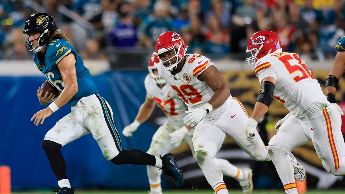 Jacksonville Jaguars quarterback Trevor Lawrence (16) rushes for yards against Kansas City Chiefs defensive tackle Jerry Tillery (99) and defensive end George Karlaftis (56) during the second quarter of an NFL football matchup at EverBank Stadium, Monday, Oct. 6, 2025, in Jacksonville, Fla. [Corey Perrine/Florida Times-Union]