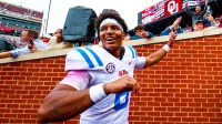 Ole Miss Rebels quarterback Trinidad Chambliss (6) celebrates with fans after the game against the Oklahoma Sooners at Gaylord Family-Oklahoma Memorial Stadium.
