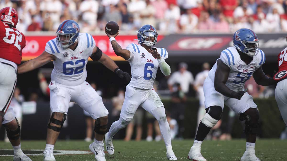 Mississippi Rebels quarterback Trinidad Chambliss (6) passes against the Georgia Bulldogs during the first half of the game at Sanford Stadium.