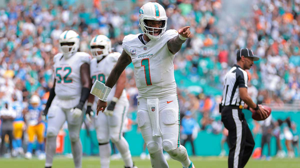 Miami Dolphins quarterback Tua Tagovailoa (1) celebrates after a touchdown by tight end Darren Waller (not pictured) during the fourth quarter at Hard Rock Stadium.