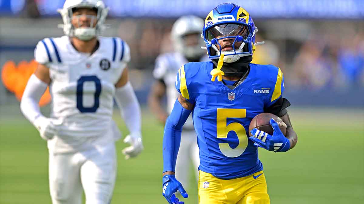 Los Angeles Rams wide receiver Tutu Atwell (5) runs for a touchdown on an 88 yard pass play in the fourth quarter against the Indianapolis Colts at SoFi Stadium.