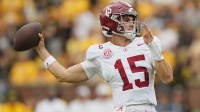 Alabama Crimson Tide quarterback Ty Simpson (15) throws against the Missouri Tigers during the first half of the game at Faurot Field at Memorial Stadium.