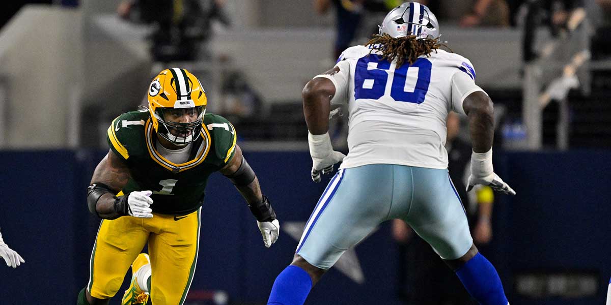 Green Bay Packers defensive end Micah Parsons (1) rushes past the block of Dallas Cowboys offensive tackle Tyler Guyton (60) during the game between the Dallas Cowboys and the Green Bay Packers at AT&T Stadium.