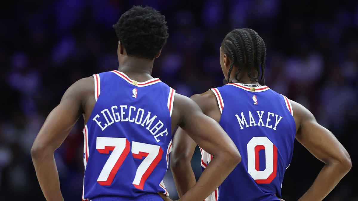 Philadelphia 76ers guard VJ Edgecombe (77) and guard Tyrese Maxey (0) look on during the third quarter against the Charlotte Hornets at Xfinity Mobile Arena.