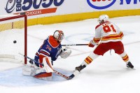 Calgary Flames forward Name Kadri (91) scores the game winning goal against Edmonton Oilers goaltender Stuart Skinner (74) during the shoot-out at Rogers Place.