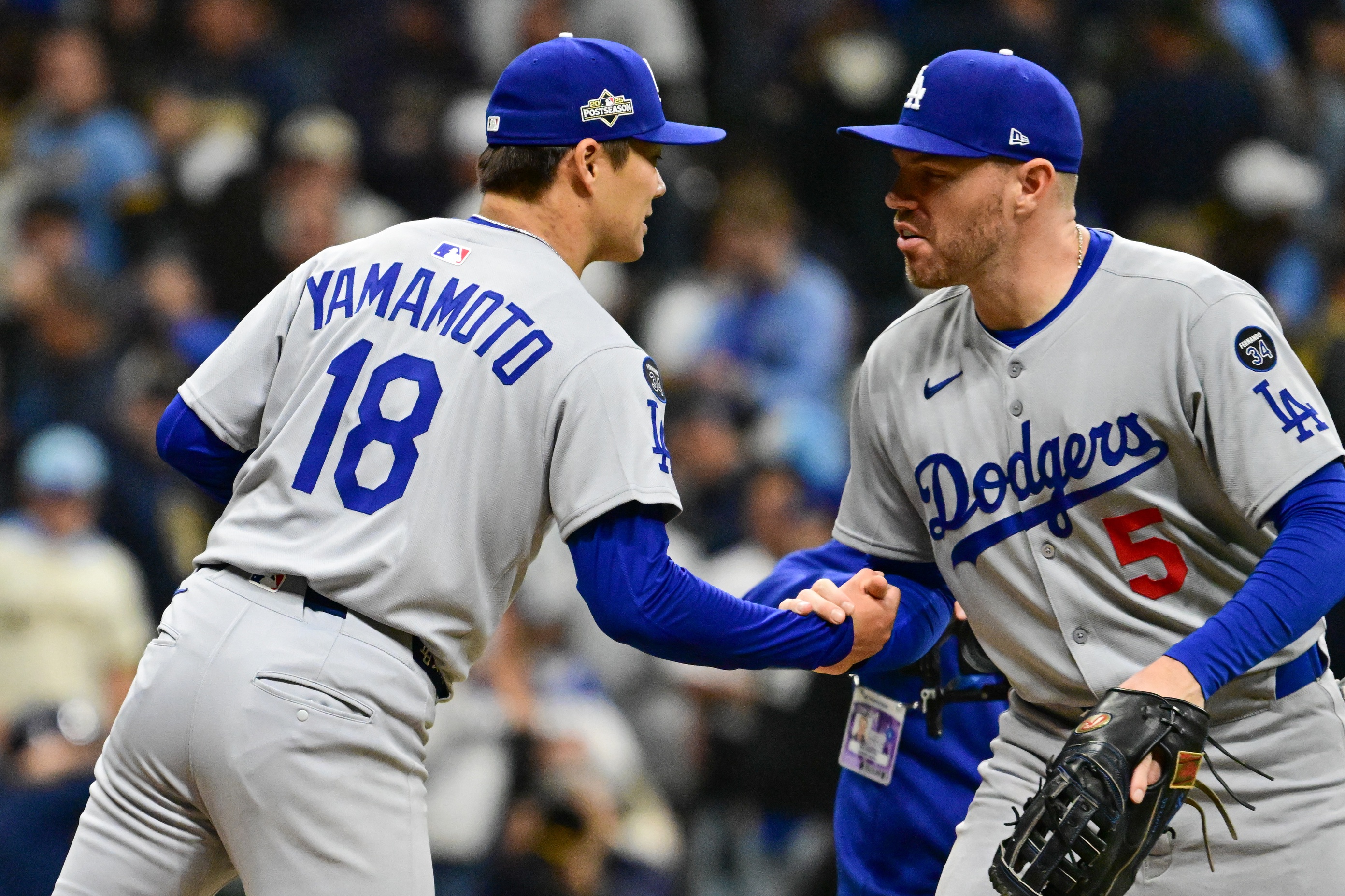 Dodgers’ Yoshinobu Yamamoto reacts to Dave Roberts letting him complete Game 2