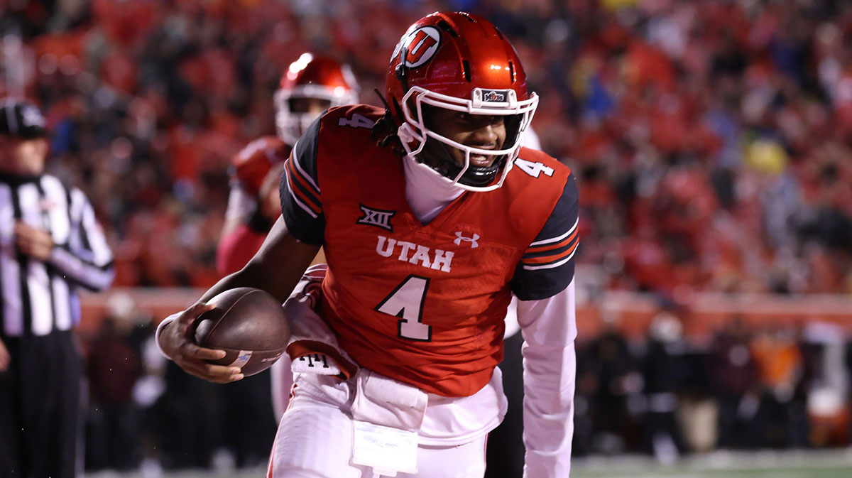  Utah Utes quarterback Devon Dampier (4) scores a touchdown against the Arizona State Sun Devils during the third quarter at Rice-Eccles Stadium. 