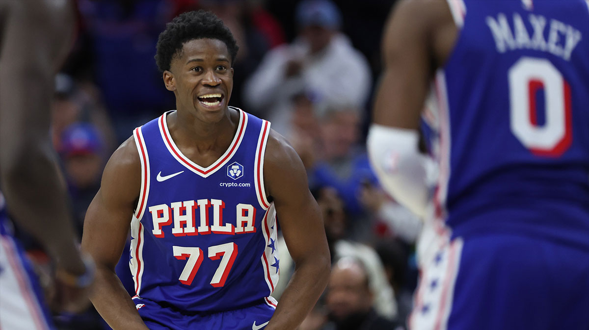 Philadelphia 76ers guard VJ Edgecombe (77) reacts to guard Tyrese Maxey (0) three pointer against the Orlando Magic during the fourth quarter at Xfinity Mobile Arena.