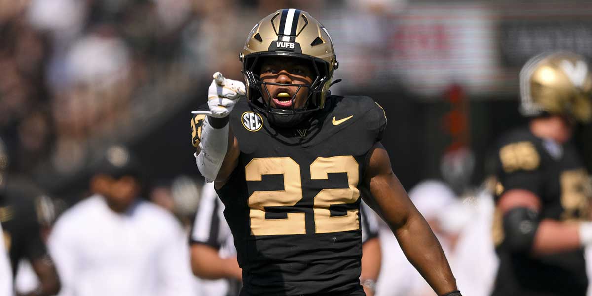 Vanderbilt Commodores running back Makhilyn Young (22) celebrates the first down against the Louisiana State Tigers during the second half at FirstBank Stadium