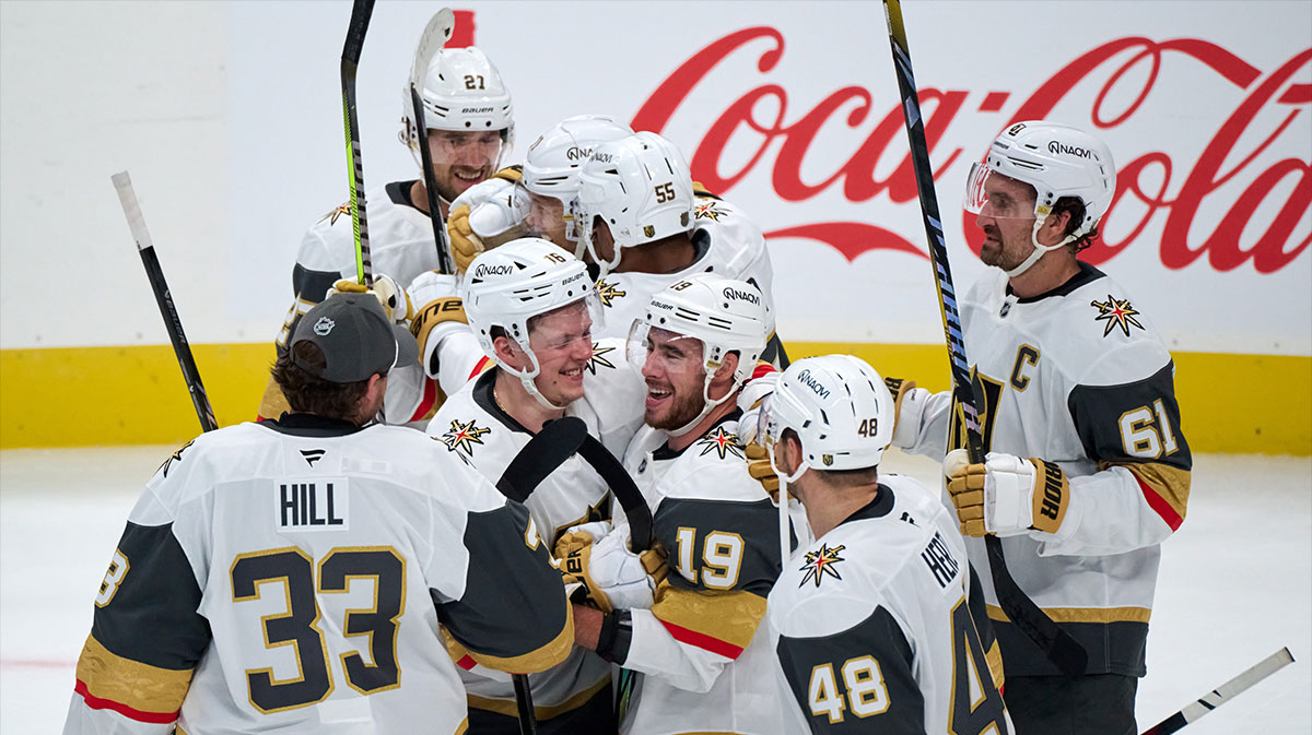 Vegas Golden Knights right wing Reilly Smith (19) celebrates with right wing Pavel Dorofeyev (16) and his teammates after scoring the game-winning empty net goal against the San Jose Sharks during the overtime period at SAP Center at San Jose.