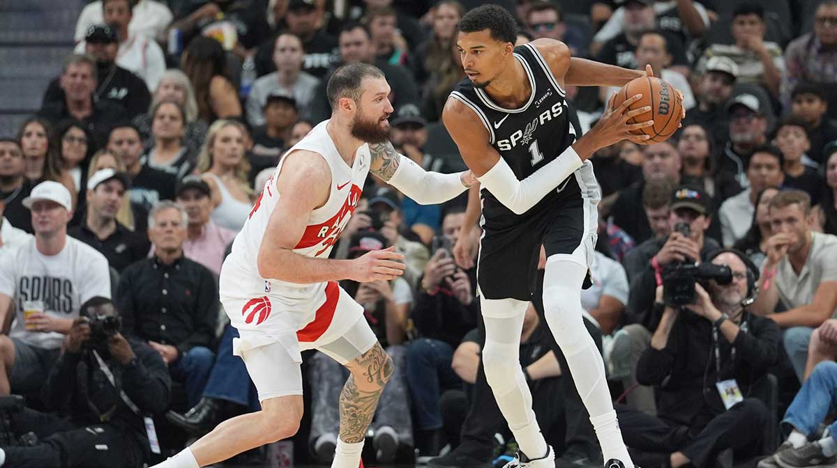 San Antonio Spurs forward/center Victor Wembanyama (1) faces off against Toronto Raptors forward/center Sandro Mamukelashvili (54) in the first half at Frost Bank Center.