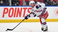 New York Rangers forward Vincent Trochek (16) shoots the puck against the Toronto Maple Leafs in overtime at Scotiabank Arena.