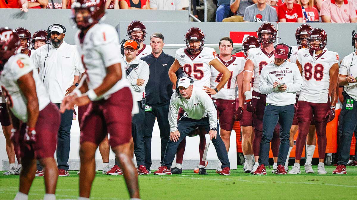 Virginia Tech Hokies interim head coach Philip Montgomery shouts to his team during the first half of the game against North Carolina State Wolfpack at Carter-Finley Stadium.