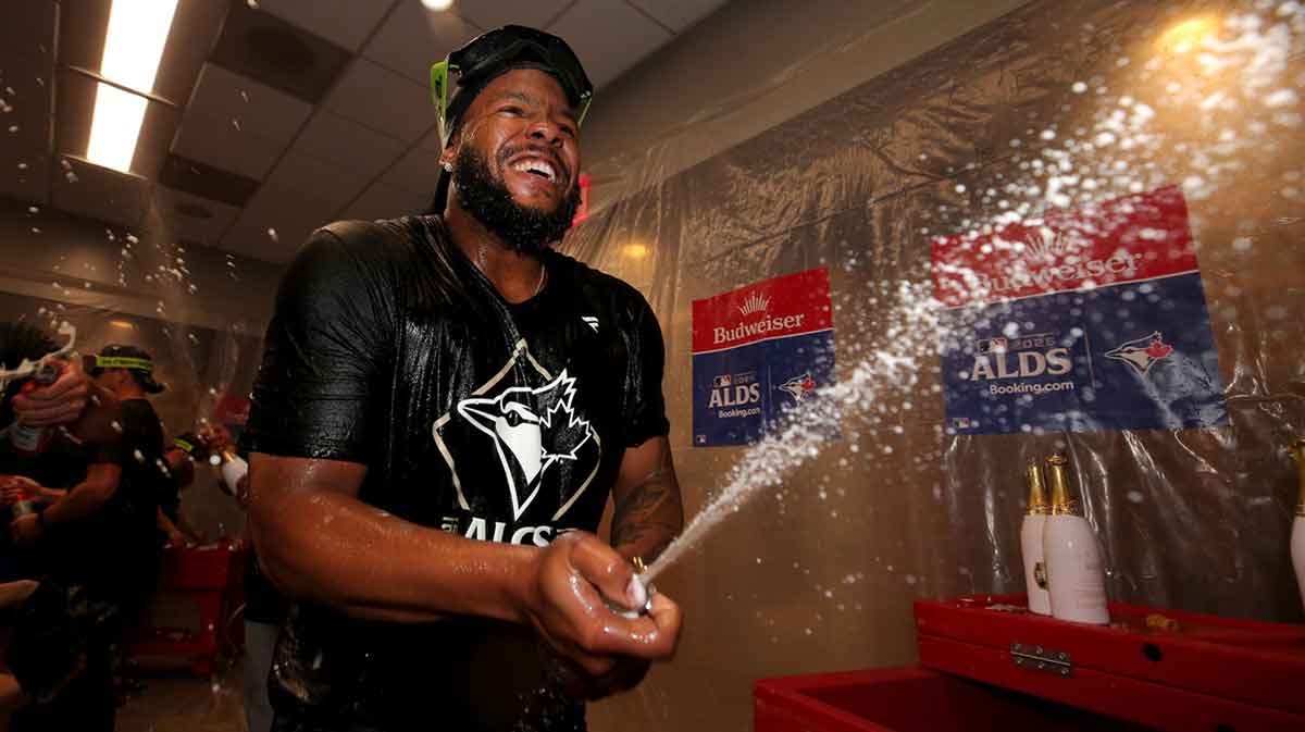 Toronto Blue Jays first baseman Vladimir Guerrero Jr. (27)celebrates in the locker room after defeating the New York Yankees in game four of the ALDS round of the 2025 MLB playoffs at Yankee Stadium.