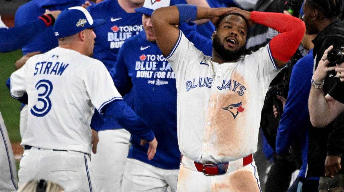 Toronto Blue Jays first baseman Vladimir Guerrero Jr. (27) celebrates with teammates after winning game seven of the ALCS round for the 2025 MLB playoffs against the Seattle Mariners at Rogers Centre.