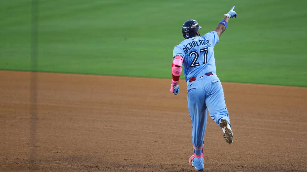 Toronto Blue Jays first baseman Vladimir Guerrero Jr. (27) celebrates after hitting a two run home run during the third inning against the Los Angeles Dodgers during game four of the 2025 MLB World Series at Dodger Stadium. 