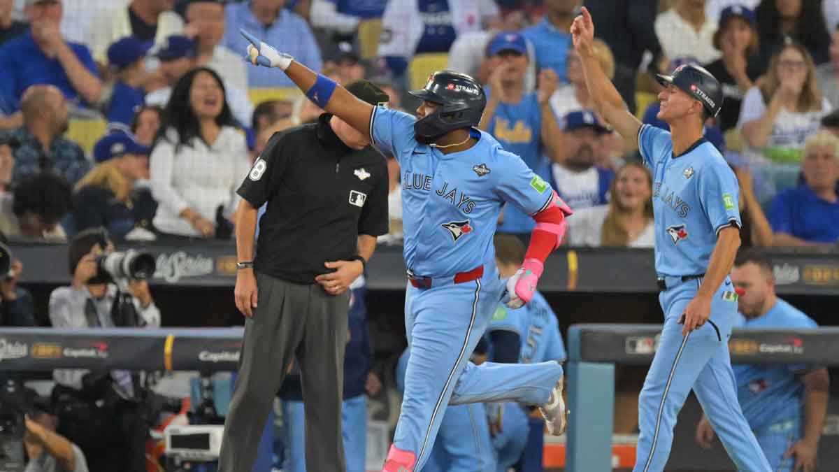 Toronto Blue Jays first baseman Vladimir Guerrero Jr. (27) celebrates after hitting a two run home run during the third inning against the Los Angeles Dodgers during game four of the 2025 MLB World Series at Dodger Stadium.