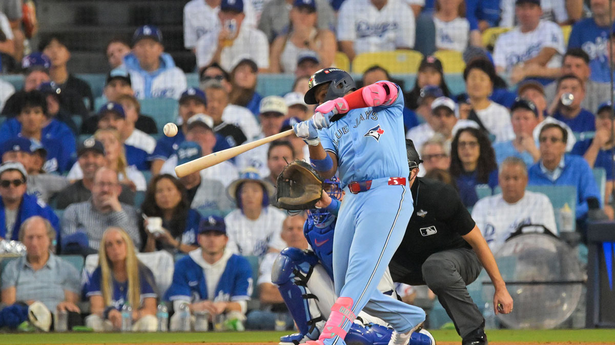 Toronto Blue Jays first baseman Vladimir Guerrero Jr. (27) hits a two run home run during the third inning against the Los Angeles Dodgers during game four of the 2025 MLB World Series at Dodger Stadium.