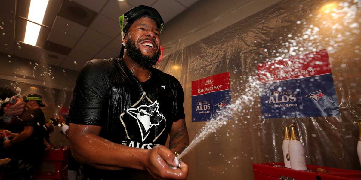 Toronto Blue Jays first baseman Vladimir Guerrero Jr. (27)celebrates in the locker room after defeating the New York Yankees in game four of the ALDS round of the 2025 MLB playoffs at Yankee Stadium. Mandatory Credit: Brad Penner-Imagn Images