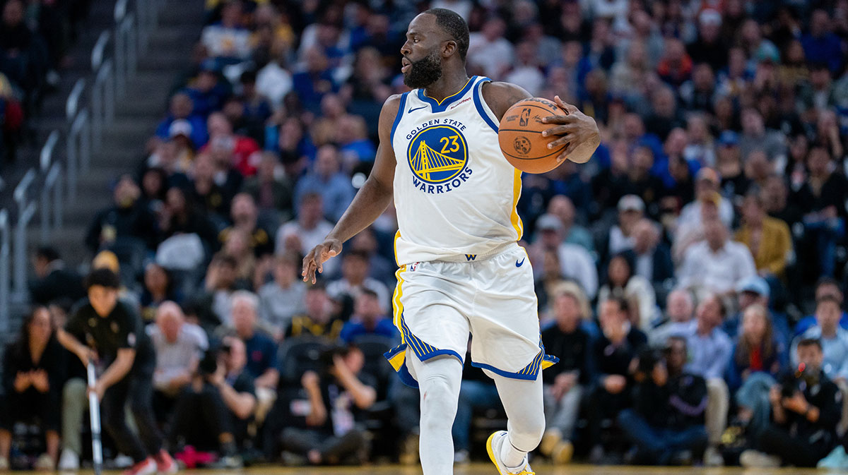 Golden State Warriors forward Draymond Green (23) dribbles the basketball against the LA Clippers during the fourth quarter at Chase Center.