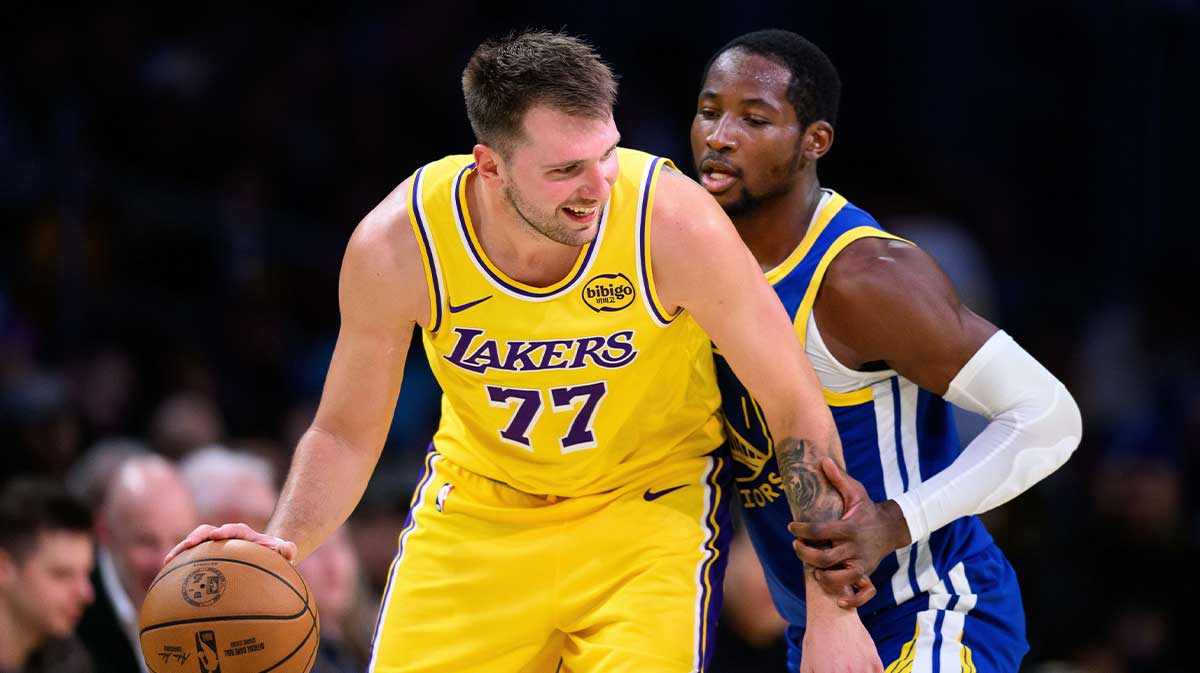 Warriors forward Jonathan Kuminga defends Lakers' Luka Doncic