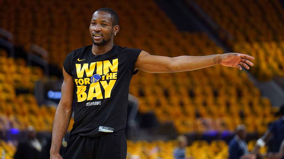 Warriors forward Jonathan Kuminga (00) stands on the court during warmups against the Minnesota Timberwolves during game four of the second round for the 2025 NBA Playoffs at Chase Center with ESPN's Marc Spears in the background