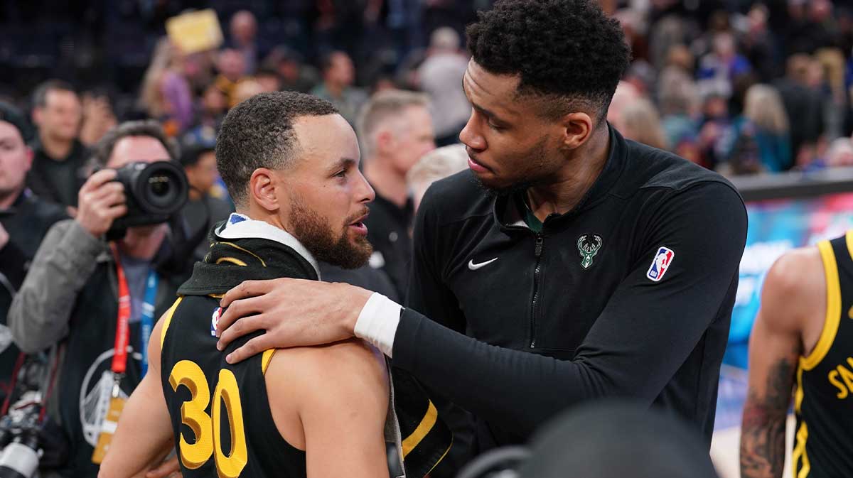 Milwaukee Bucks forward Giannis Antetokounmpo (34) and Golden State Warriors guard Stephen Curry (30) meet after the game at the Chase Center.